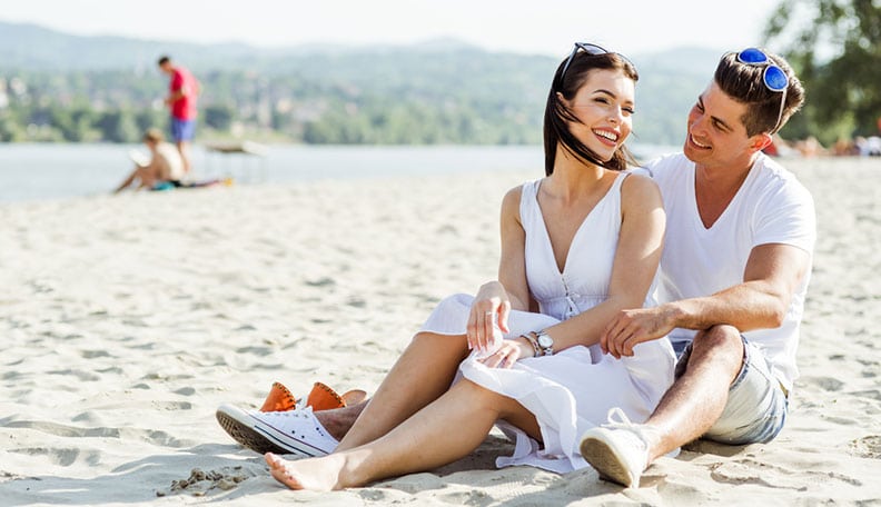 Couple gossiping on the beach