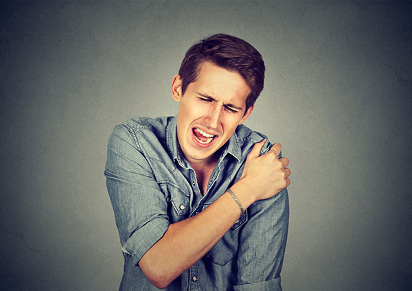 man suffering from neck or shoulder pain isolated 