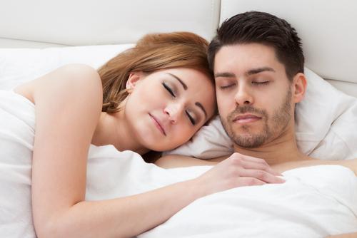 couple sleeping happily