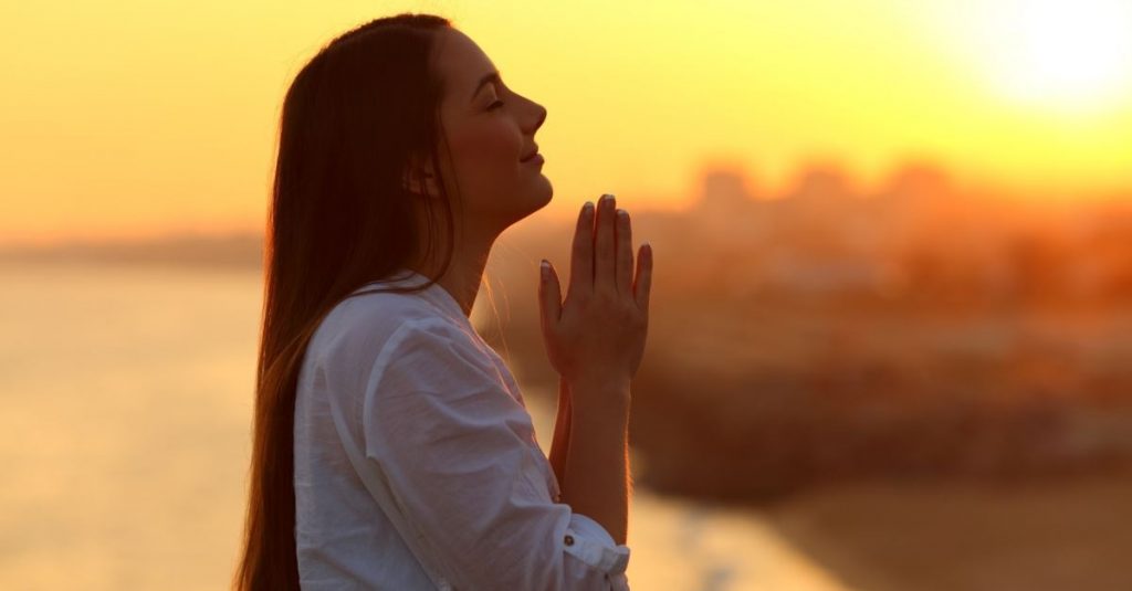 praying to god with folded hands