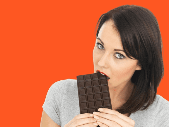 women eating Dark Chocolate 