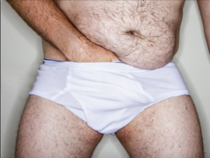 person experiencing groin itching and discomfort after shower